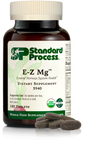 Image of E-Z Mg bottle next to tablets of magnesium supplements.