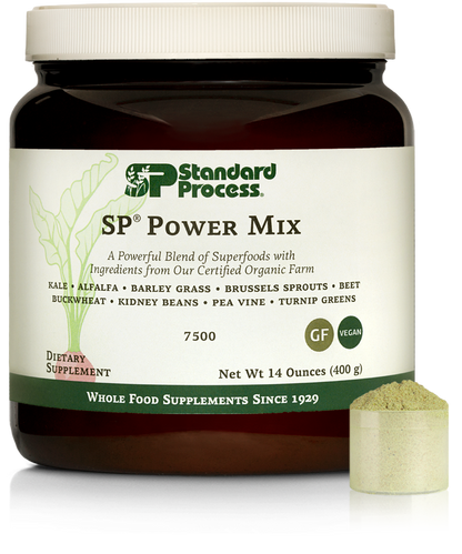 Tub of SP Power Mix next to a scoop of the green powder.